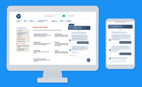 Image of a hand holding a smartphone displaying the "USA.gov" homepage with a search bar, navigation links, and the U.S. flag, set against a blurred background.