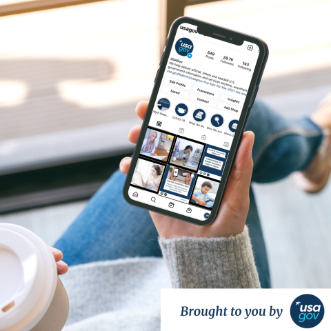 Image of a person holding a smartphone displaying the "usagov" Instagram page with 549 posts and 28.7K followers, featuring various government-related images, with a coffee cup and "Brought to you by usa.gov" text below.